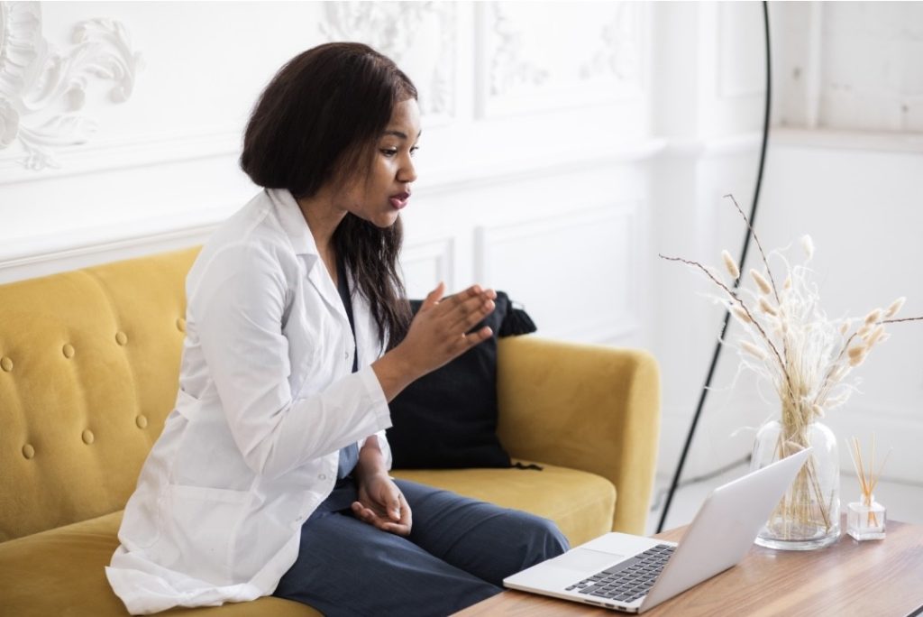 Female professional speaking during an online consultation.