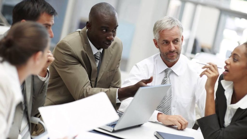 Business meeting with diverse colleagues discussing.